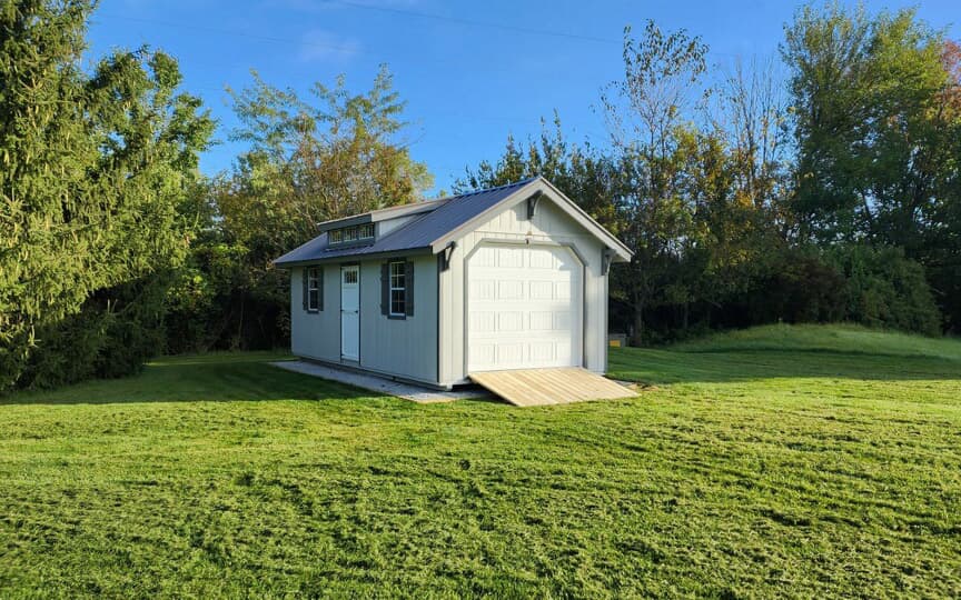 Garage shed with ramp in backyard