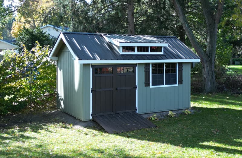 Garden shed in backyard surrounded by trees