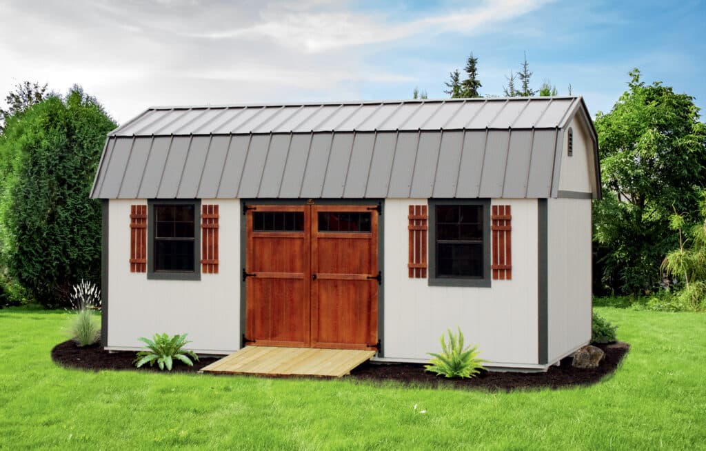 white shed with brown trim and gray metal roof built after having obtained shed permit in Indiana
