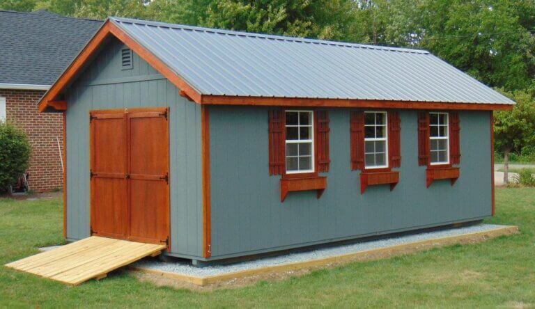 Garage shed by brick building