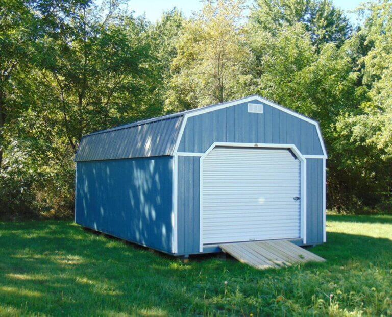 Blue garage shed by trees