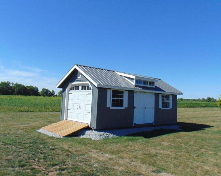 Garage shed by field
