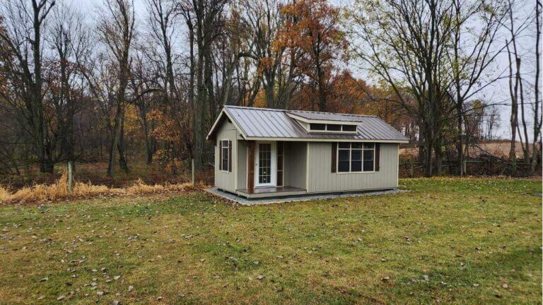 Backyard office by trees and grass