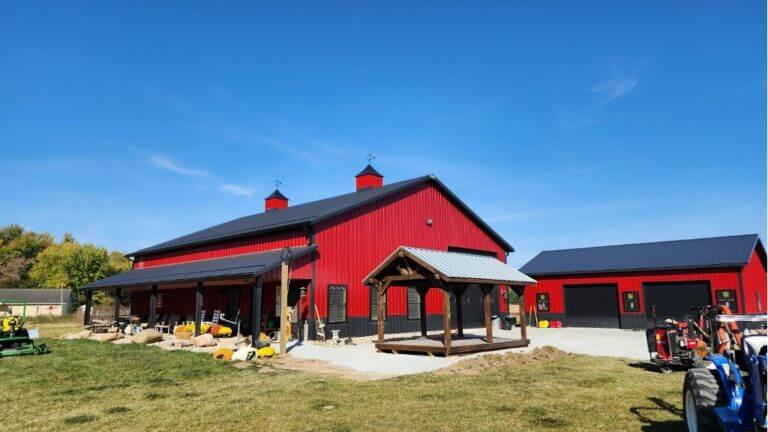 Backyard pavilion by red barn