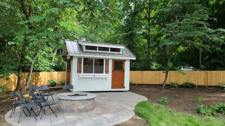 Small backyard shed by firepit
