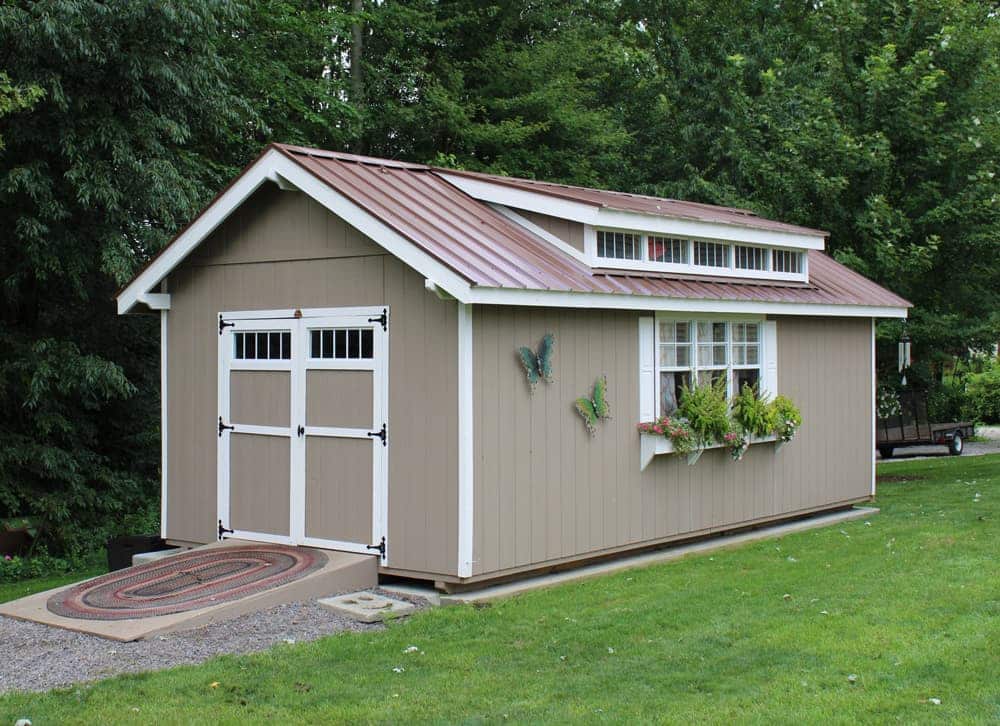 Customized shed in backyard with flowerpots